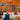 a living room with orange walls and a white couch